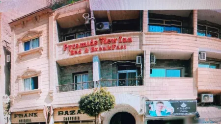 Pyramids View Inn Отели в г. Nazlet El-Semman