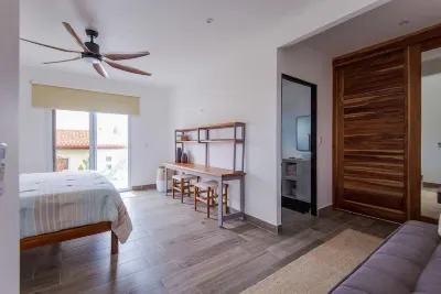 Steps from beach with private pool, rooftop terrace & swim up bar beach club!