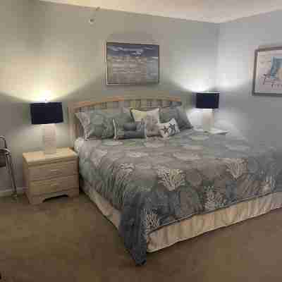 Enjoy beautiful sunsets from the balcony or wade into the waves just steps away! Rooms