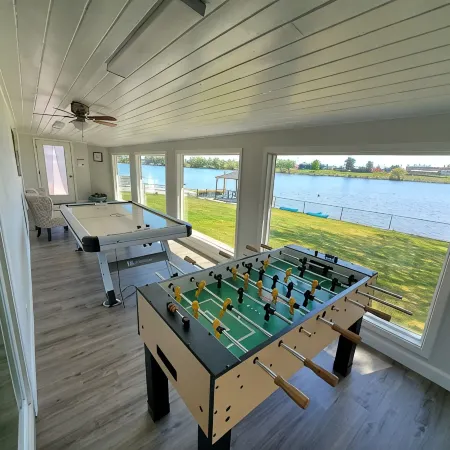 Lakefront Getaway. Private Waterfront Home with Dock and Sunroom.