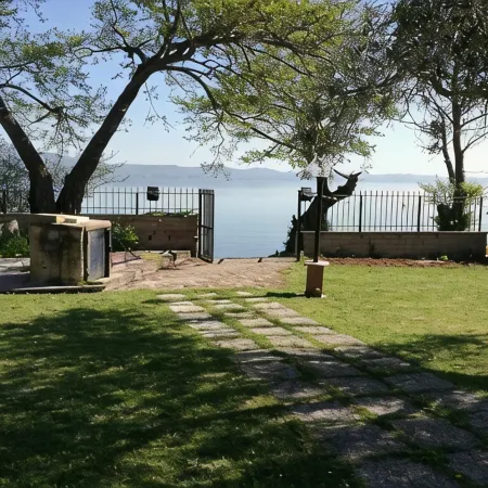 Independent villa with private beach on the lake