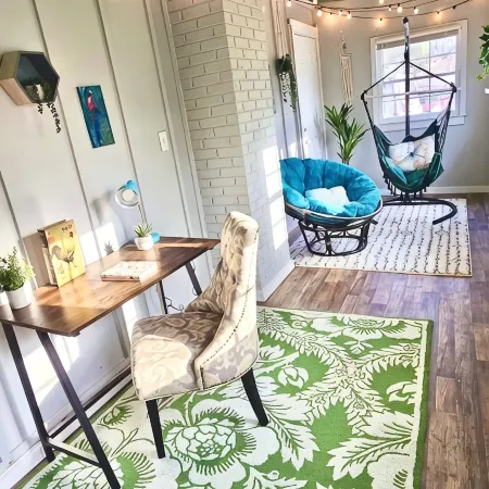 Updated 4-bedroom house with relaxing sunroom; minutes from downtown Raleigh.
