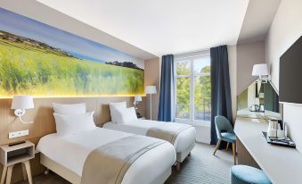 a hotel room with two twin beds , a large window , and a painting on the wall at Best Western le Beffroi