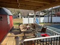 River Road Retreat.  Cabin minutes away from trails w/ hottub & seasonal pool!