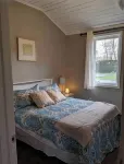Spacious 4-bedroom waterfront house in Sylvan Beach with private yard and dock.