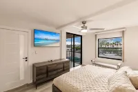 Vanderbilt Beach Condo, Bay Views, New Saltwater Pool, Walk to Beach