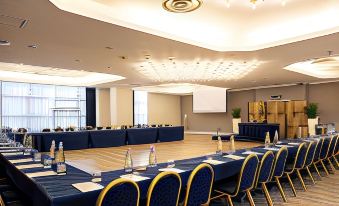 a conference room set up for a meeting , with chairs arranged in rows and a table in the center at Best Western CTC Hotel Verona
