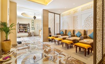 a luxurious spa or lounge area with a marble floor , seating , and a few chairs at Resort Rio