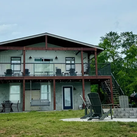 BRAND NEW Lake Front home. Private cove and boat dock! Modern farmhouse appeal!