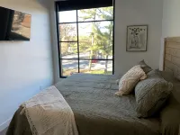 BOHO CONDO w/Rooftop Hot Tubs! 2 minutes to downtown TC & Beaches. Dog Friendly! - 4-Star