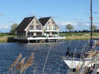 Pfahlhaus Perle am Yachthafen Carolinensiel Harlesiel ❤️, Living on the water - 4-Star