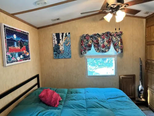 Parkmodel cabin w screened porch in campground on bike trail.