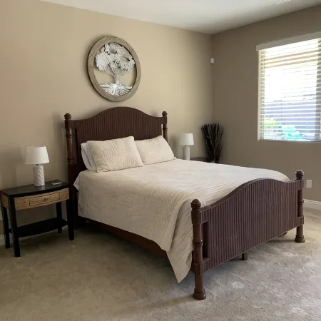 Great family friendly home very private back yard, heated pool & covered patio.