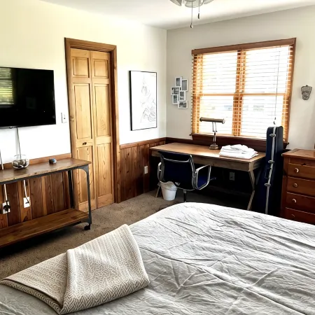 Three-bedroom house with views, decks, golf cart and home gym!