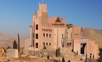 "a large , beige - colored building with a pointed roof and the word "" mosca "" written in red , situated on a desert - like" at Grand Mercure Petra