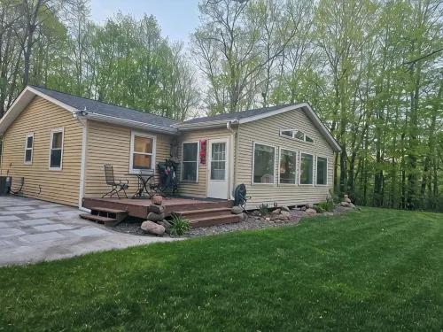 Relax in 3 bed, 2 bath house on quiet 2 acres with private lake.