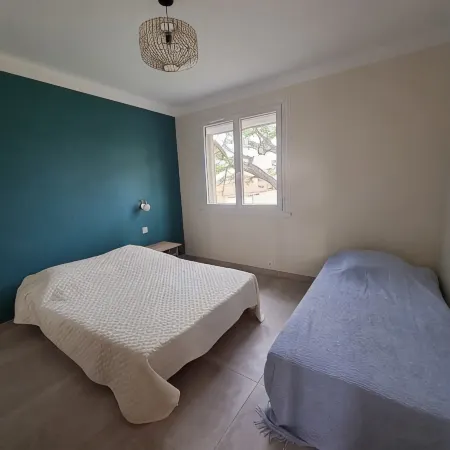 Apartment with balcony upstairs of a villa 300 m from the sea