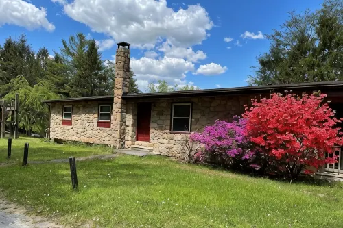 Great lodging for Penn State events and view of Lake Louise at Camp Golden Pond. - 2-Star