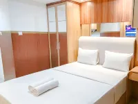 Wooden Touch Studio at Tamansari Skylounge Makassar Apartment By Travelio - Apartments