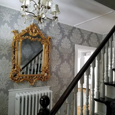 Enjoy comfortable elegance in this secluded grand home located in town