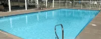Custom 4-Bedroom Home w/Boat Slip, Private Fenced Backyard & Swimming Pool.