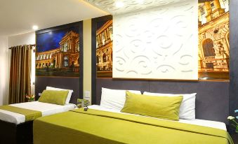 a hotel room with two beds , one on the left side and the other on the right side of the room at Eurotel Angeles