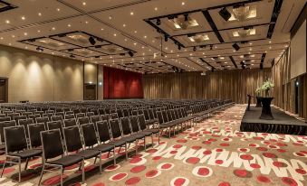 a large conference room with rows of chairs arranged in a semicircle , ready for a meeting at Pullman Melbourne Albert Park