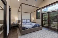 Modern ski house with gourmet kitchen, ski views, hot tub/pool, steps to gondola