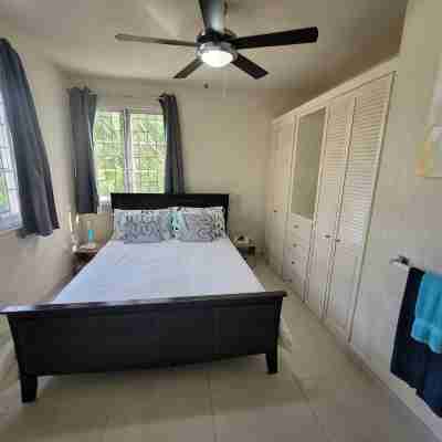 A modern and spacious house, steps to the beach with a private pool!! Rooms