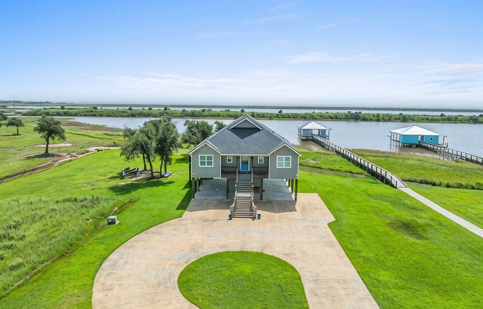 REEL N  REST in Hackberry LA ! Waterfront home with beautiful views .