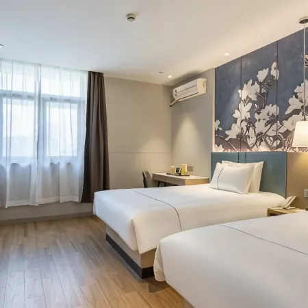 Magnolia Hotel (Qizilou Branch, Lishui University)