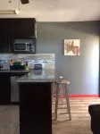 Cozy  apartment with beach 7 mins drive away. CAR RENTAL , A.C , CABLE,WIFI,
