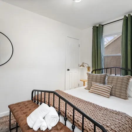 Urban Oasis: A Charming Downtown Retreat with Game Room, Firepit and Yard Games