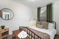 Urban Oasis: A Charming Downtown Retreat with Game Room, Firepit and Yard Games