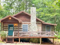 Cozy Cabin in woods with Hot Tub, Porch Swing Bed and Fire Pit in Aska Adventure - 3-Star