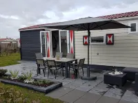 Charmingly decorated chalet Florence 2 near the sea serooskerke Hotels in Serooskerke