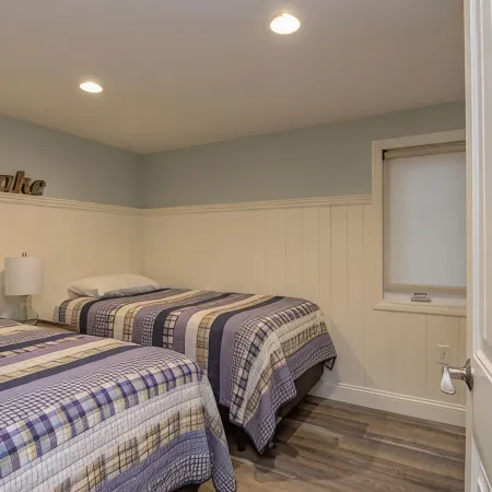 Relax in Raymond's lakefront 2-bedroom vacation home, just steps to Sebago Lake