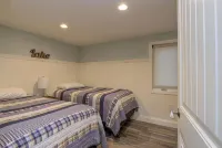Relax in Raymond's lakefront 2-bedroom vacation home, just steps to Sebago Lake