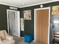 Updated bungalow with screened in porch  in rear.