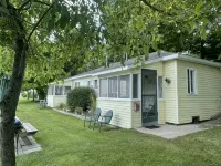 Cottage 1 is a charming 2 bedroom only 25’ from its boat dock & Hamlin lake. - 2-Star