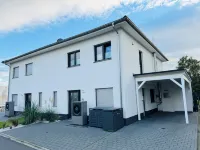8P "Seegelblick" Vacation Home on the Waterfront with a Hot Tub, Sauna, and Fireplace - Homestays