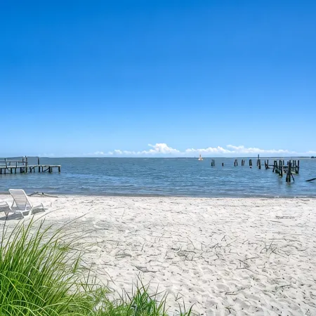 No Cleaning Fee! Brand New Double Queen Studio Condo w/ Waterfront Pool + Beach