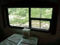 White Mountain Scenic River Camp with Cozy Cabin & Comfy RV