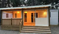 Your mobile home with covered terrace and barbecue is waiting for you this summer.