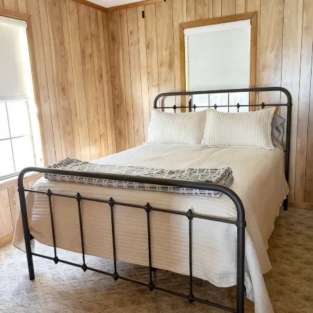 3-bedroom cabin nestled on 80 acres with WiFi, AC on private 5-acre lake.