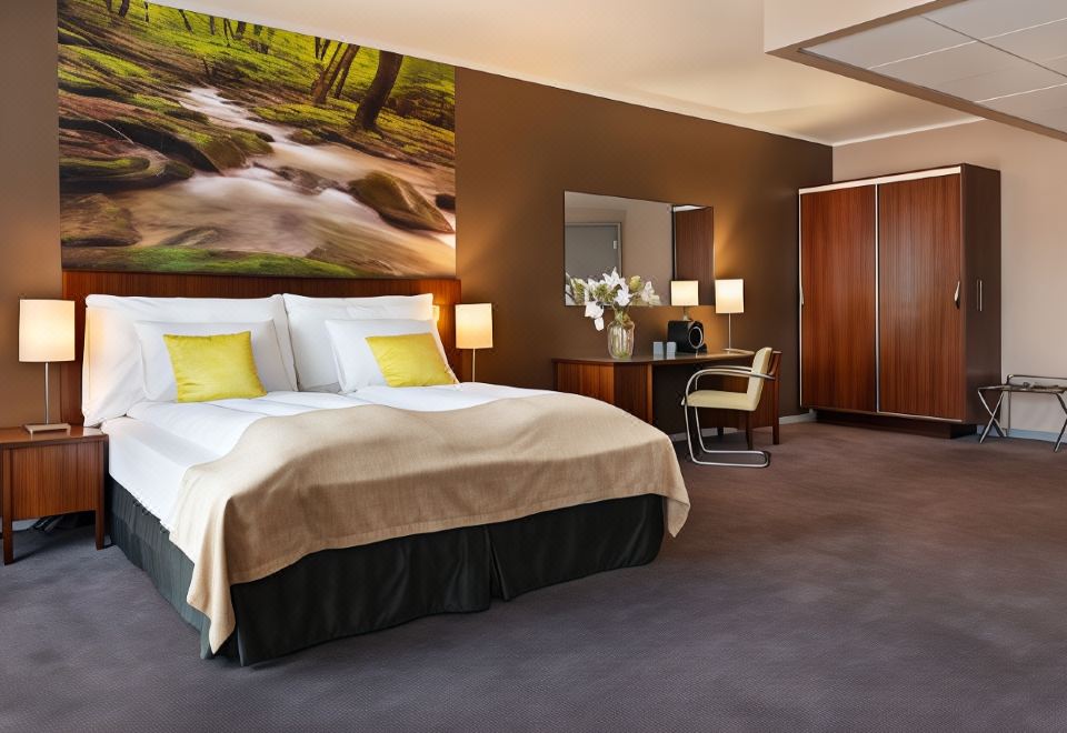 a modern bedroom with a large bed , wooden furniture , and a painting of a forest on the wall at Quality Hotel Grand Kongsberg