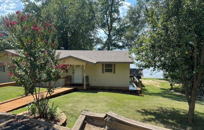 Peaceful lake front home with wrap around porch and relaxing views!