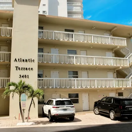 BEACHFRONT COMPLEX! STEPS FROM THE OCEAN! HEATED POOL FULL KITCHEN FREE PARKING