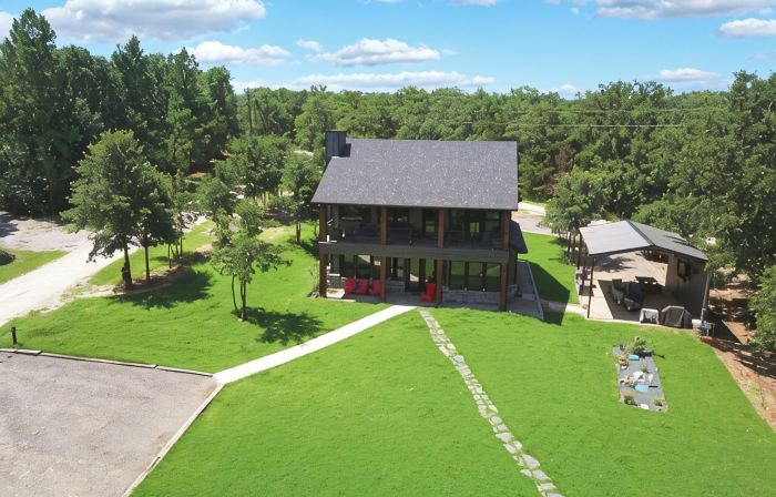 Richland Chambers Lakefront 2-story home with boat dock and pavilions.