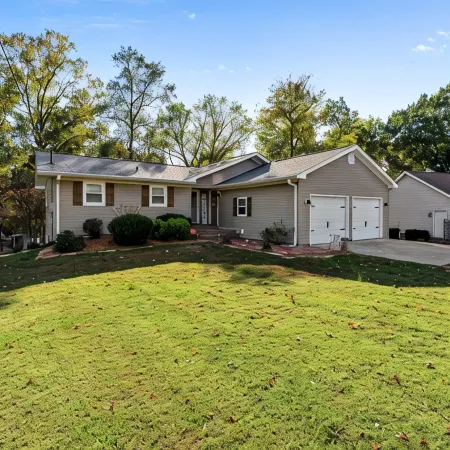 3 bedroom/2 full bath lakefront home with gentle slope to private covered dock